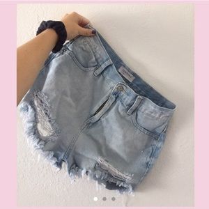 Highwaisted distressed denim shorts